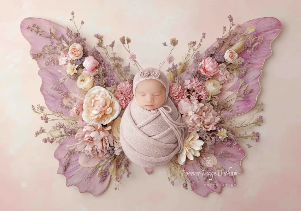 Baby in floral-themed butterfly outfit